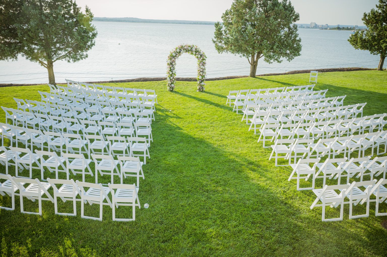 Waterfront wedding ceremony set up on the lawn at Amarante's Sea Cliff